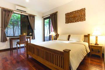 Luxury Interior design in bedroom of pool villa with cozy  bed