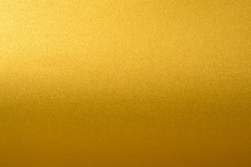 Obraz premium Details of golden texture background with gradient and shadow. Gold color paint wall. Luxury golden background and wallpaper. Gold foil or wrapping paper.