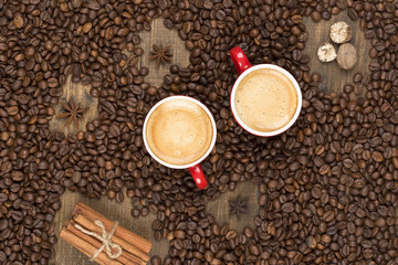 Coffee with foam in a cup on a wooden surface