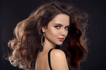 Fashion portrait of gorgeous sexy brunette woman with long healthy hair style and evening makeup,...