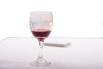 a glass of wine on a white background