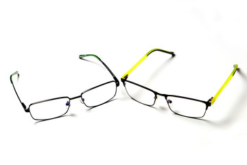 Eyeglasses are placed on a white background.