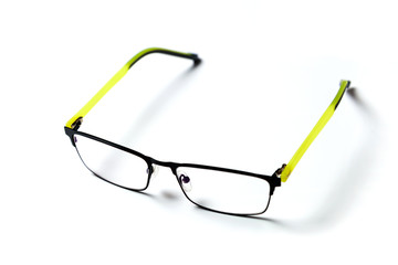 Eyeglasses are placed on a white background.