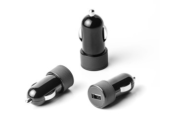 Black USB electronics car charger device for mobile phone isolated on white
