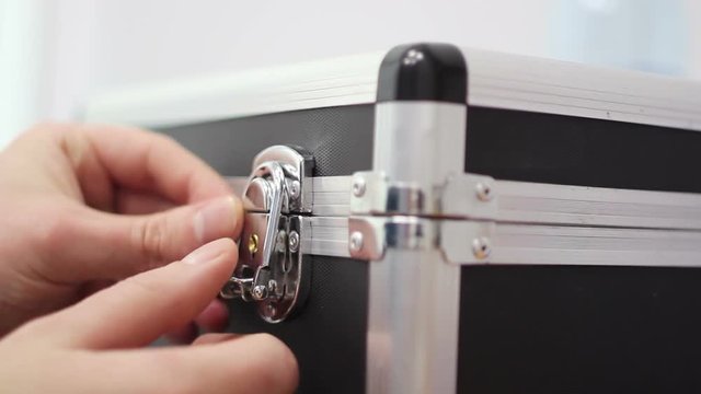 The Man Closed The Locks on the Case