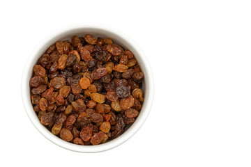 bowl of sweet dry raisins isolated on a white background,top view.