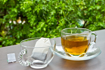 Two cups of tea on the table in the garden