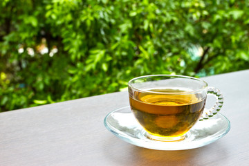 A cup of tea on the table in the garden