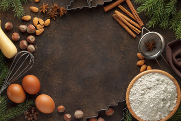 Rusty christmas baking background with ingredients for cooking holiday pastry.