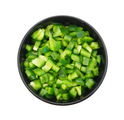 sliced green bell pepper in a bowl on white background