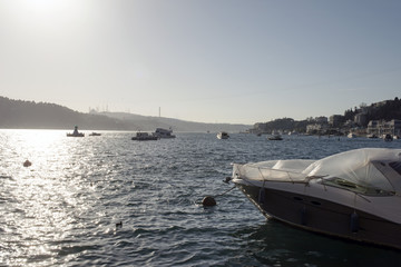 Obraz premium A view of bosphorus bay and the bridge and motor boats in Istanbul, Turkey