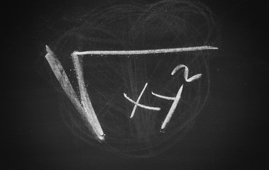 Mathematical formula, equation symbol, sign on chalkboard, blackboard texture