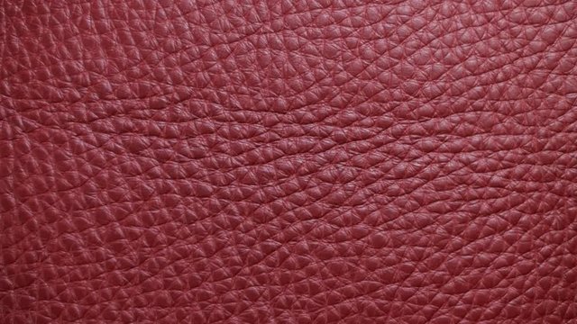 Structure, texture and surface pattern of red, yellow skin. Light moves around the sample. Macro. Closeup 
