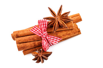 cinnamon sticks and anise stars on white