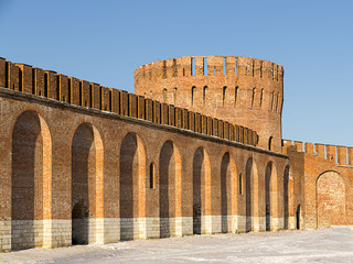 arched wall old fort brick Russian city round big tower with a crenellated roof. Smolensk, Russia, January 2015