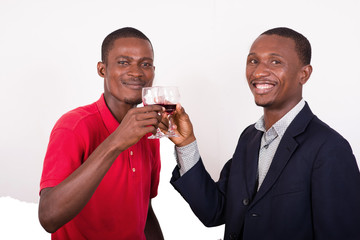 two happy men toast with glasses of wine