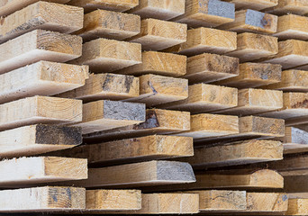 warehouse building materials board spruce light beige background pattern close-up