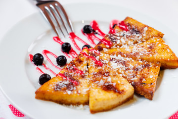 Small pancakes with raspberries and bilberries