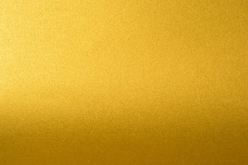 Naklejka premium Details of golden texture background with gradient and shadow. Gold color paint wall. Luxury golden background and wallpaper. Gold foil or wrapping paper.