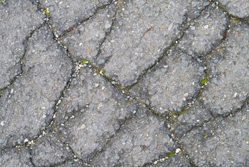 Closeup of damaged asphalt