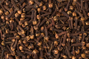 dry cloves spice as a background, natural seasoning texture
