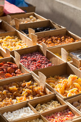 Different types of dried fruits for sale on a local market in France, Europe.