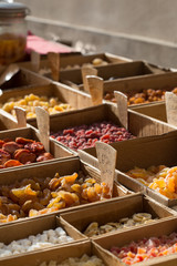 Different types of dried fruits for sale on a local market in France, Europe.