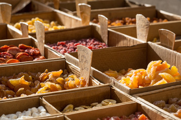Different types of dried fruits for sale on a local market in France, Europe.