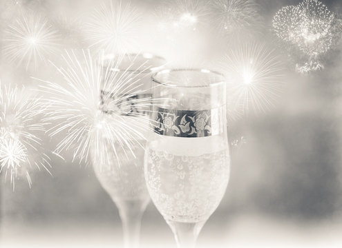 Champagne glasses and fireworks. New Year background
