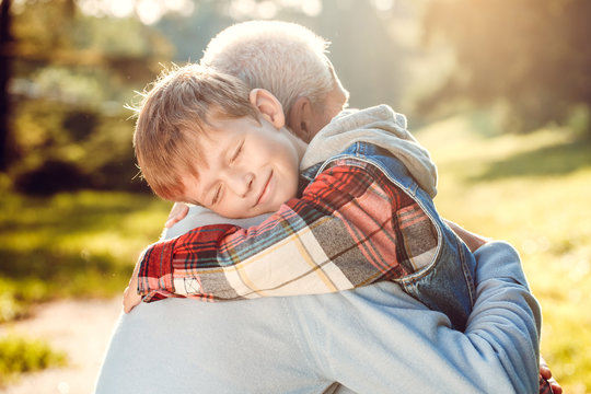 Grandfather And Grandson Together Outdoors Family Concept