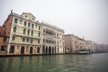 Fototapeta na wymiar Famous palaces on the Grand Canal in Venice, Italy. Moisture
