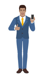 Businessman with mobile phone showing thumb up