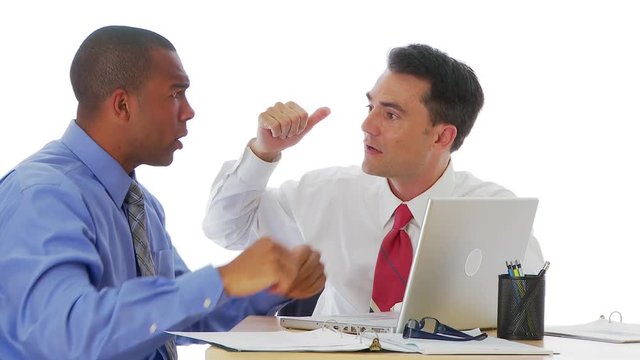 Two businessmen arguing at desk