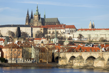 View on the winter Prague gothic Castle with the Charles Bridge in the sunny Day, Czech Republic