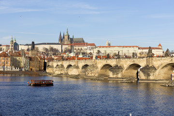 View on the winter Prague gothic Castle with the Charles Bridge in the sunny Day, Czech Republic