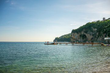 MONTENEGRO, BUDVA - MAY 30/2017: tourists jumping into the Adriatic Sea from the pier.