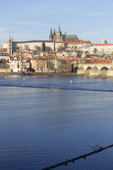 View on the winter Prague gothic Castle with the Charles Bridge in the sunny Day, Czech Republic