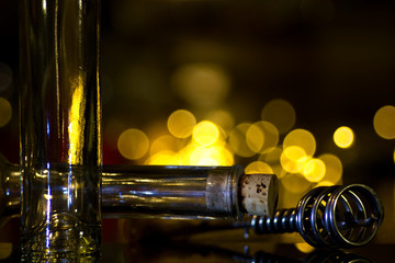 Background holiday, wine corkscrew and glass.
