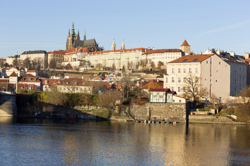 Obraz premium View on the winter Prague gothic Castle above River Vltava in the sunny Day, Czech Republic
