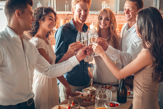 Group of friends party together indoors celebration