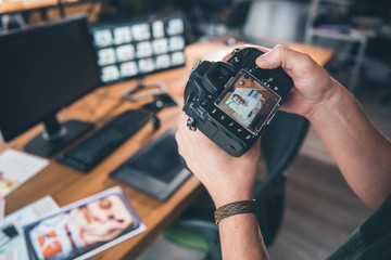 Close up male arm keeping digital device with screen. Photo of cheerful man locating it. Image concept