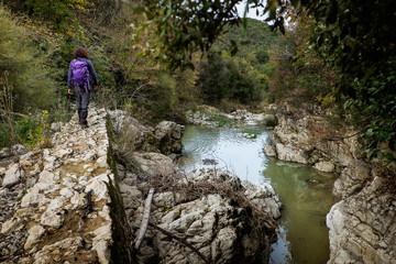 Fototapeta premium Montecatini Val di Cecina, Pisa, Italy - November 7, 2017: It is an itinerary in the Monterufoli Nature Reserve, monumental great work are the stone bridges