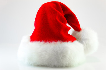 Obraz na płótnie Canvas Santa Claus or christmas red hat isolated on white background