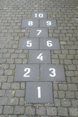 Fototapeta na wymiar Hopscotch court with numbers from 1 to 10