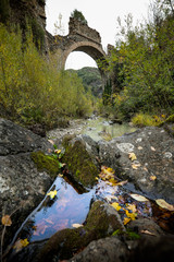 Fototapeta na wymiar Montecatini Val di Cecina, Pisa, Italy - November 7, 2017: It is an itinerary in the Monterufoli Nature Reserve, monumental great work are the stone bridges