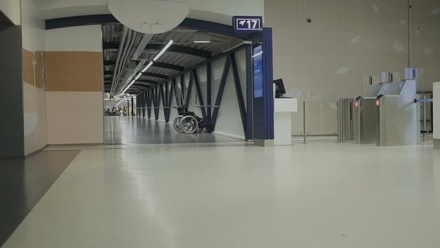 Patient senior at Helsinki airport working with smartphone