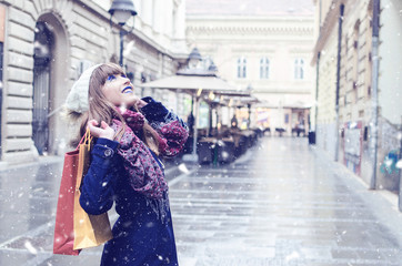 Teenager in Christmas shopping outside