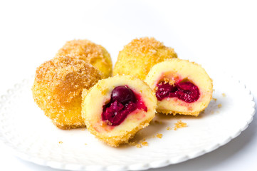 Homemade bread crumb dumplings with cherry isolated