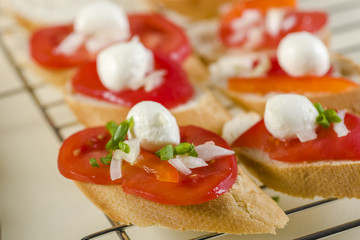 bruschetta with tomatoes, mozzarella, Parma ham and basil