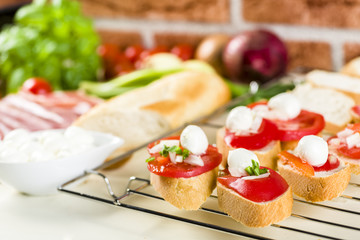 bruschetta with tomatoes, mozzarella, Parma ham and basil